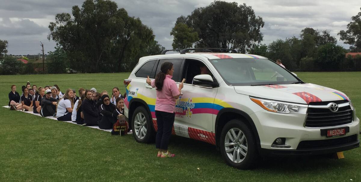 Blind spot: Year 10 students from Young High School were shocked that the person in the driver seat could not see their classmate at the end of the mat during the Georgina Josephine Foundation education awareness day.