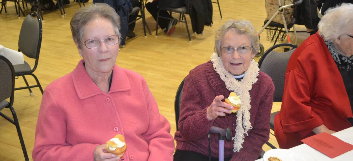 Patricia Debnam and Joan Wall enjoying some of the delicious slices at the annual Young Hospital Auxiliary Soup Day fundraiser.