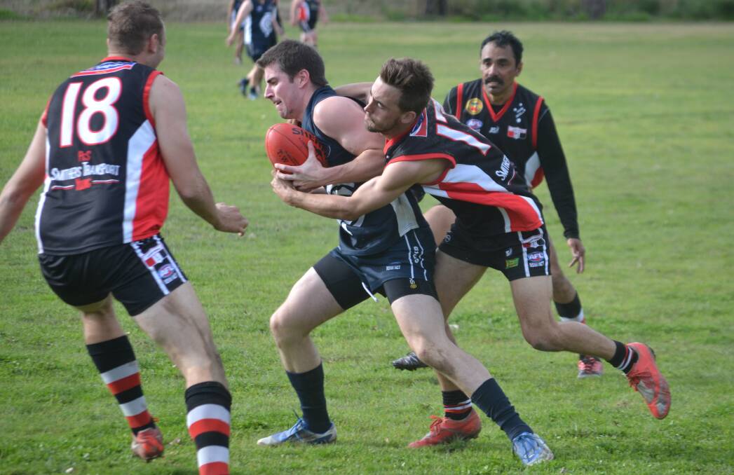TOUGH: Young's Cameron Elsley was put to the test in the weekend's match against ladder leaders, Cowra. Photo: Peter Guthrie