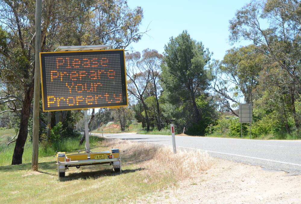 SAFETY: RFS has placed signs along the Wombat Road reminding locals to prepare their property this fire season. 
