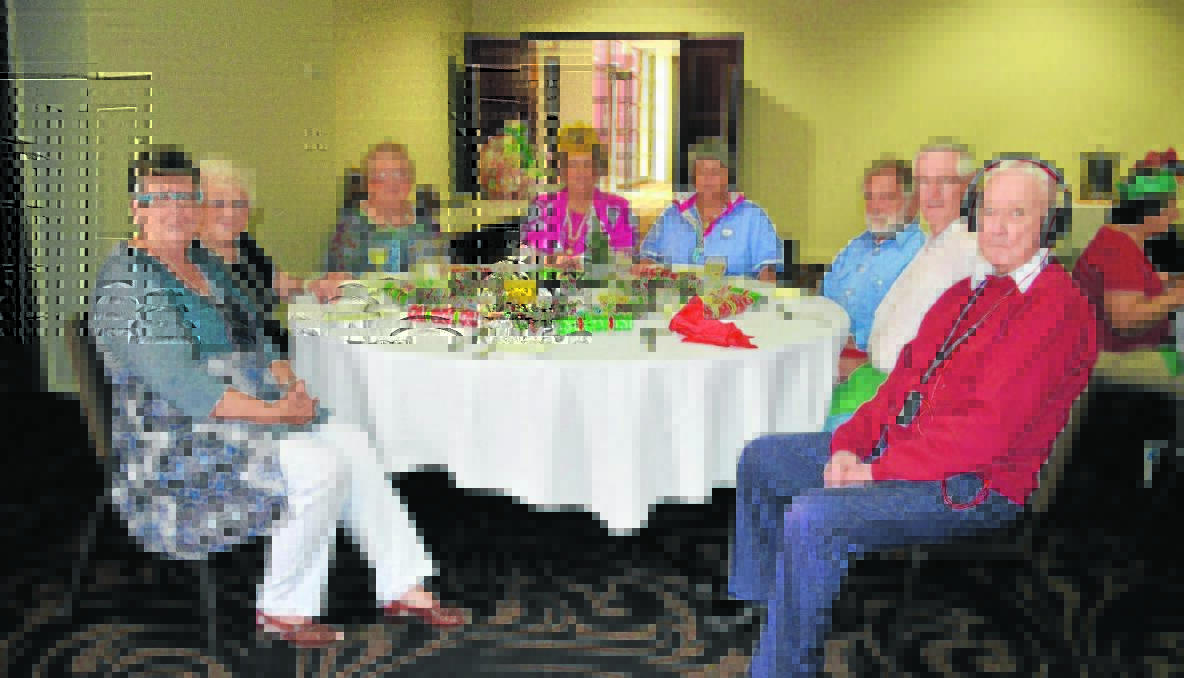 MEMBERS: (Clockwise from front) Helen Waugh, Jean Spring, Joan Spring, Clare Freudenstein, Sandy Freudenstein, Russell Price, Terry Waugh and Les Murray were entertained by the bush poet at the Combined Pensioners Christmas party.