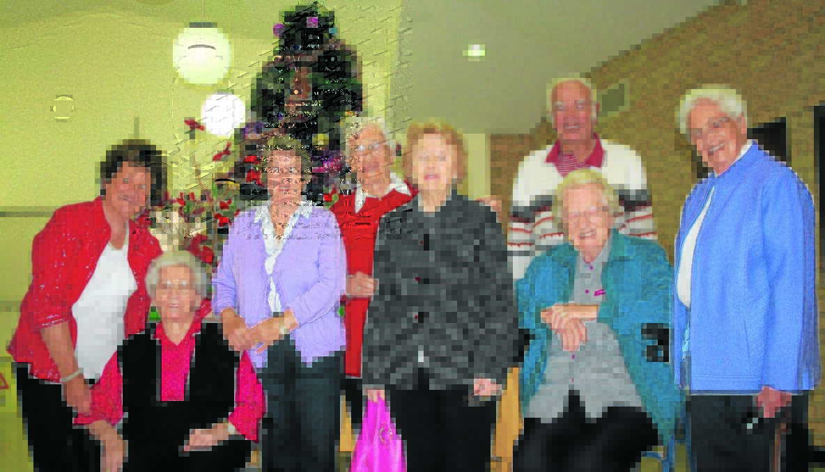 MERRY: Shirley Smithers, Gwen Brown, June Greaves, Sister Monica Purcell, Marigold Costello, Walter Briggs, Sister Mavis Hanlon and Sister Maureen Hummerston were all smiles after a wonderful Christmas lunch at the Southern Cross Care.