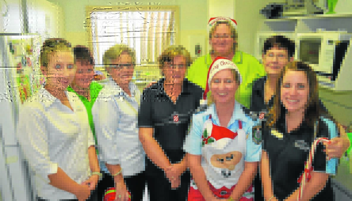 HELPERS: Job Centre Australia’s (JCA) Patricia Dawe, Kulie Veitch of Campbell Page, Margaret Luff (JCA), Salvation Army’s Elizabeth Eldridge, Campbell Page’s Colina Meadows, Youth case manager Senior Constable Karen Clark of the PCYC, Salvation Army’s Laurel Merrin and Kristy Wilton (JCA) at The Salvation Army's Christmas lunch.