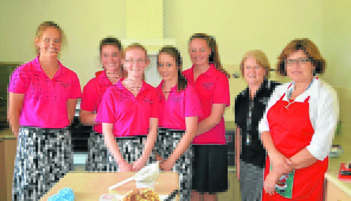 COOKS: Year 10 Hennessy Catholic College students Ellie Burstall, Brooke Blake, Amelia Jones, Emily McIllhatton and Sam Doolan with Lynne Maher and Mrs Jenny Philpot catered at the Senior Citizens Christmas luncheon. ABSENT: Mary Johnson.