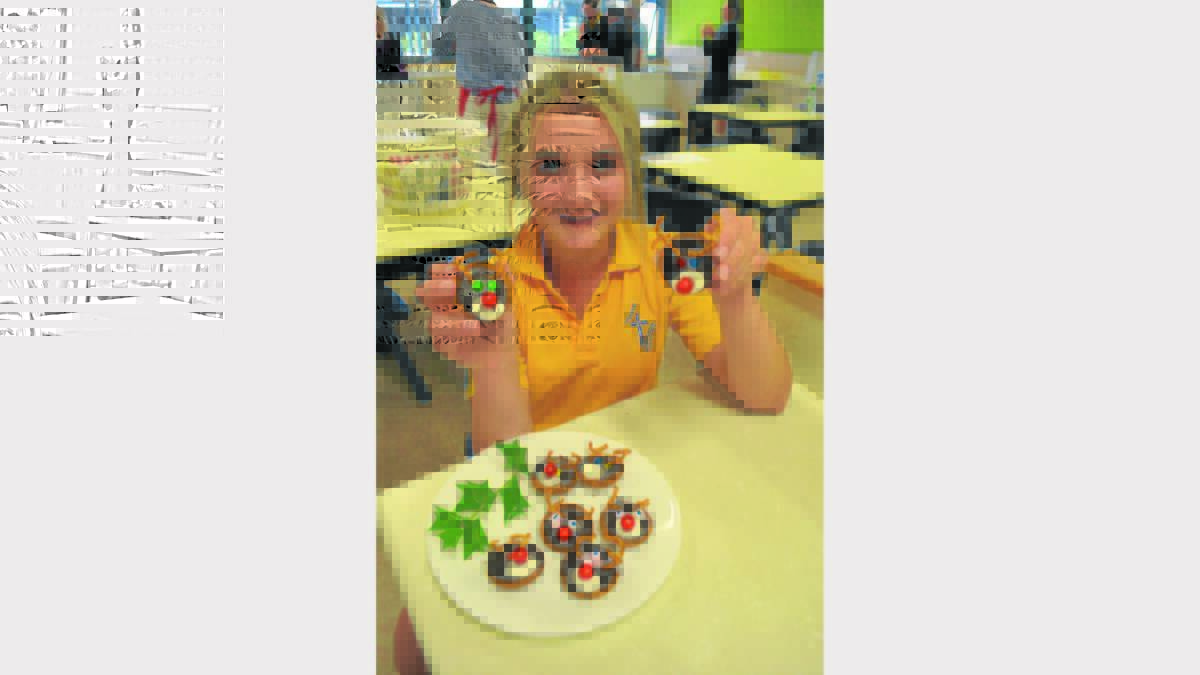 REINDEER: Year 9 Hennessy Catholic College student, Karlee Barton, with some cute reindeer biscuits they made in class.