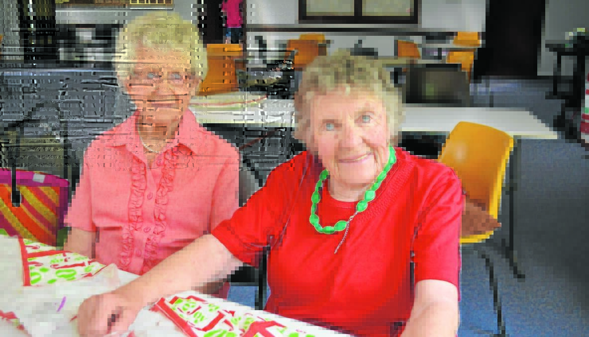 LUNCH: Joan Swan and Pat Ryan at the Young Senior Citizens Christmas luncheon.